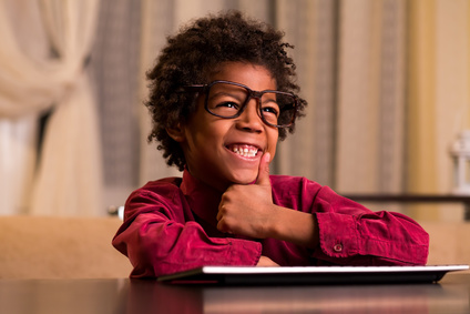 Boy smiling at computer